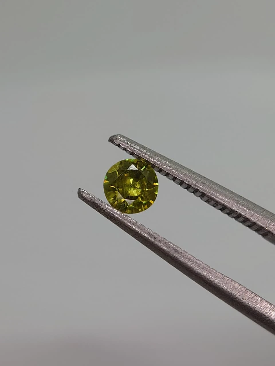 0.3ct Round Faceted Demantoid Garnet from Pakistan — view 4